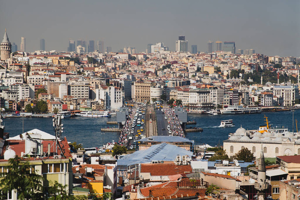 Panoramic shot of the Galata Bridge on the Golden Horn connecting Karakoy and Eminonu, Istanbul, Turkey, traffic during day time, from above - Photo, Image