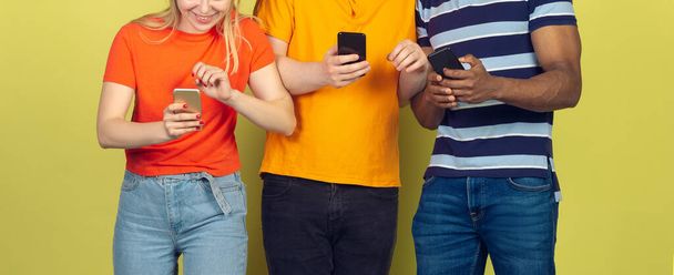 Group of friends using mobile smartphones. Teenagers addiction to new technology trends. Close up. - Fotó, kép
