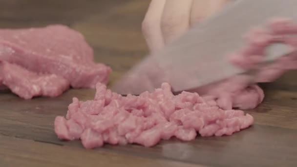 meal prepping. Dicing raw meat with a knife - Footage, Video