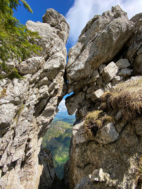 An opening in the rock below the alpine peak of Widderfeld in the Swiss mountain range of Pilatus and in the Emmental Alps, Alpnach - Canton of Obwalden, Switzerland (Kanton Obwalden, Schweiz) - Photo, Image