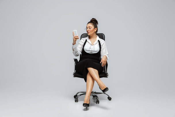 Young caucasian woman in office attire. Bodypositive female character. plus size businesswoman - Fotó, kép