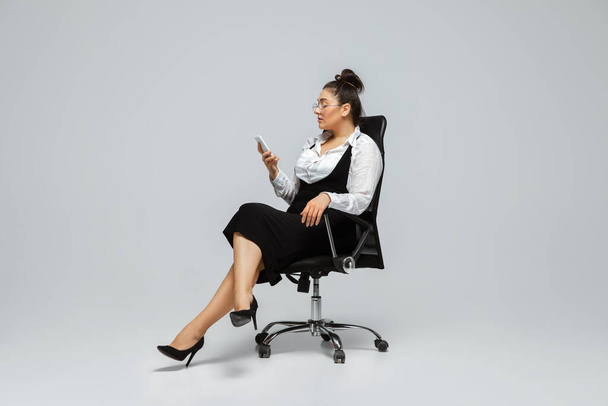 Young caucasian woman in office attire. Bodypositive female character. plus size businesswoman - Fotó, kép