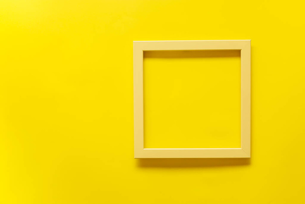 Yellow vintage frame on yellow background. Top view, blank space - Foto, immagini