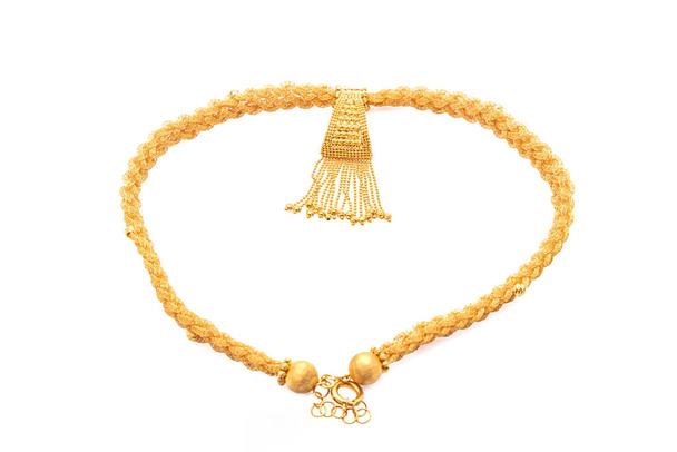 A image showing indian golden necklace on isolated white background.  - Photo, Image