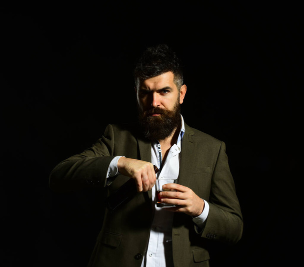 Businessman with serious face in suit on black background - Zdjęcie, obraz