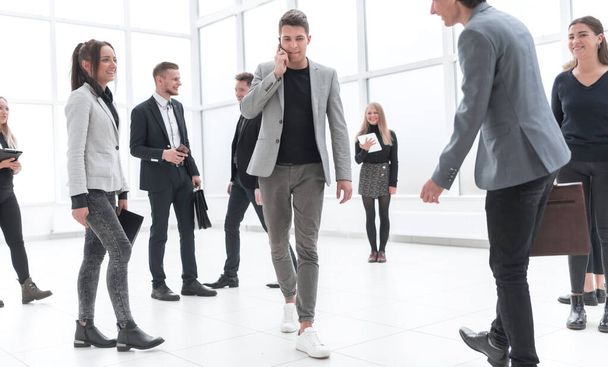 group of different business people passing in the office lobby. - Fotoğraf, Görsel