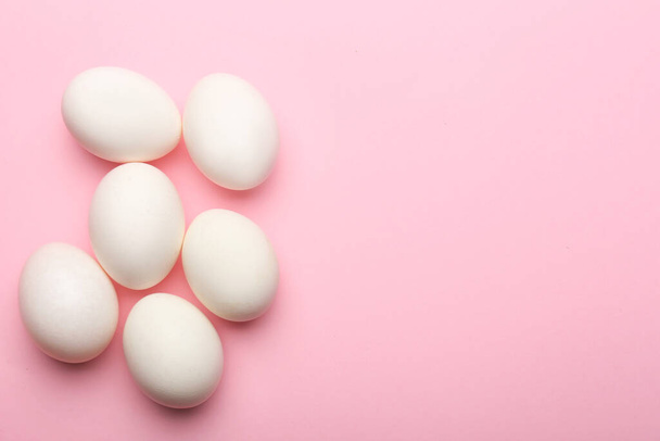 Fresh chicken eggs on color background - Foto, imagen