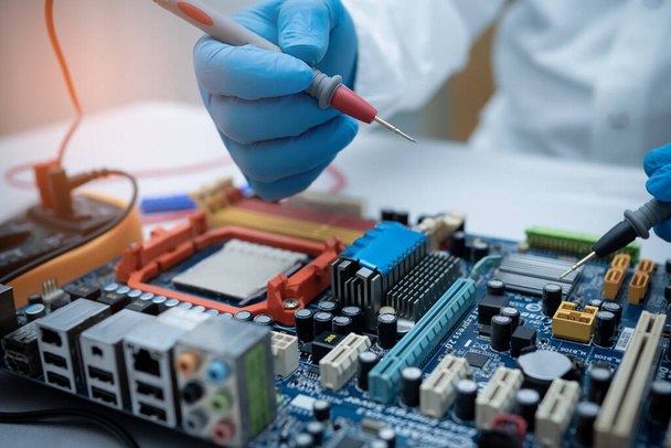 technician repairing inside of hard disk by soldering iron. Integrated Circuit. the concept of data, hardware, technician and technology. - Photo, Image