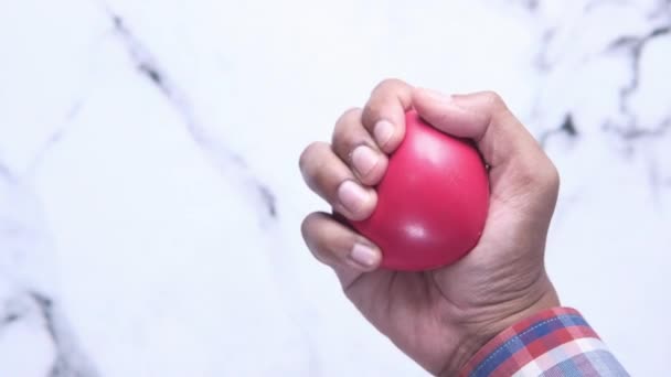 Red heart gets squeezed by hand - Footage, Video