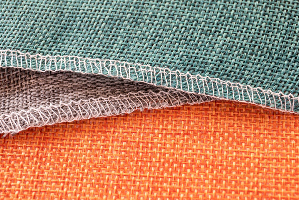 Textiles naranjas, grises y verdes. Tela para decoración, bordado
 - Foto, Imagen