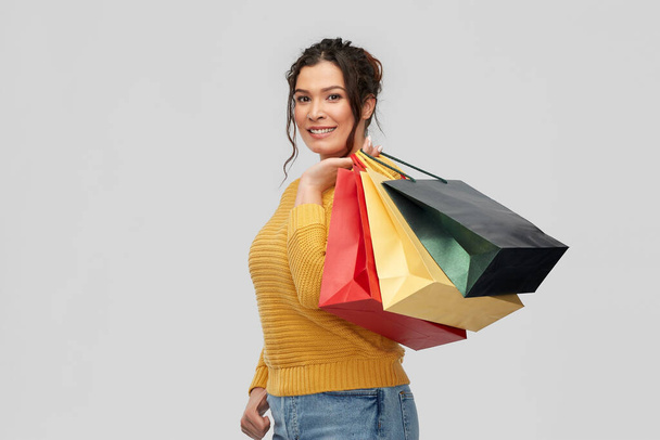 happy smiling young woman with shopping bags - Photo, image