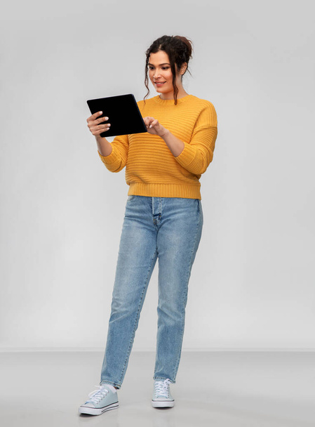 happy young woman using tablet pc computer - Фото, изображение