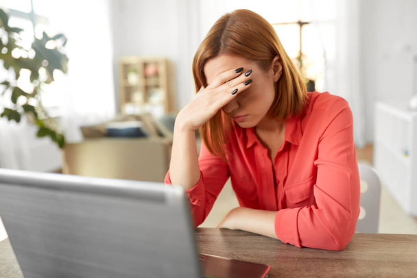 stressed woman with laptop working at home office - Φωτογραφία, εικόνα
