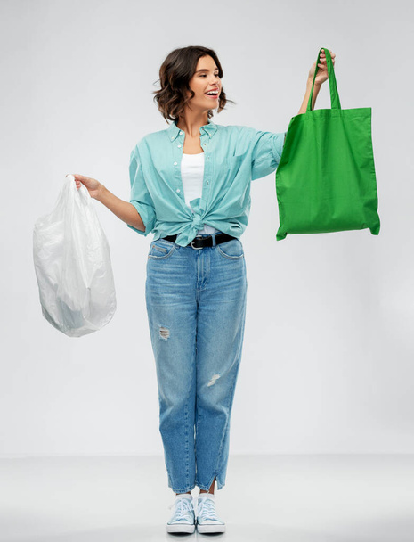 woman with plastic and reusable shopping bag - Photo, image