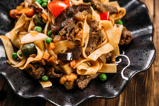 Asian style pasta tagliatelle beef and vegetables - Photo, Image