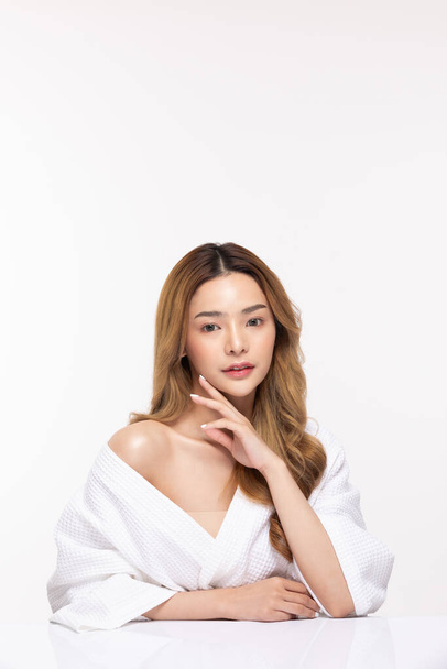Beautiful Asian woman wearing bathrobe smile with clean and fresh skin Happiness and cheerful with positive emotional,isolated on white background,Beauty Cosmetics and spa Treatment Concept - 写真・画像