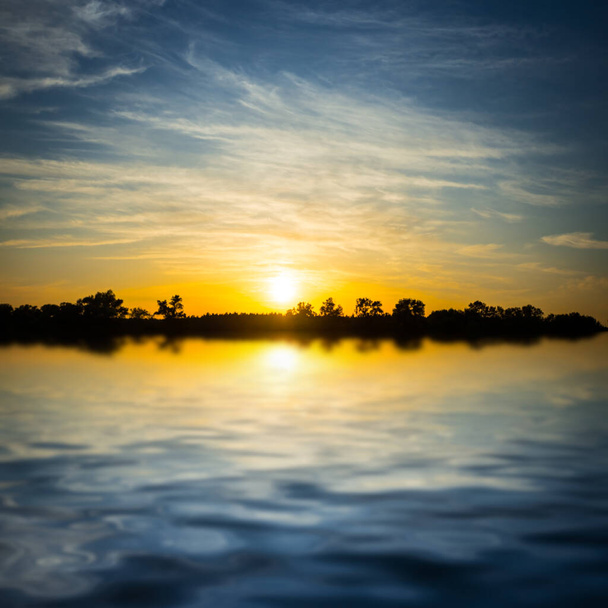 sunset reflected in a water, dramatic countryside outdoor background - Foto, immagini