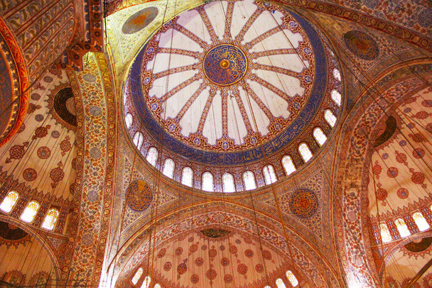 Interior of The Blue Mosque also known as Sultan Ahmed Mosque,hand-painted blue tiles adorn the mosques interior walls in Istanbul, Turkey.  - 写真・画像