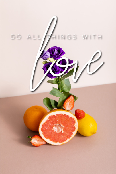 floral and fruit composition with purple eustoma and summer fruits near do all things with love lettering on beige - Photo, Image