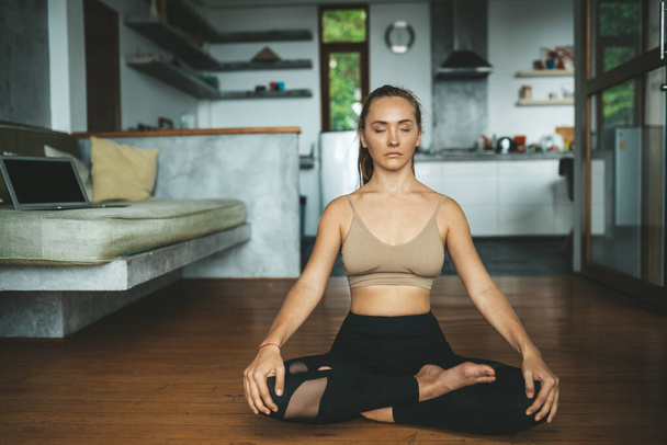 Woman practicing home yoga. Meditation. lifestyle concept - 写真・画像