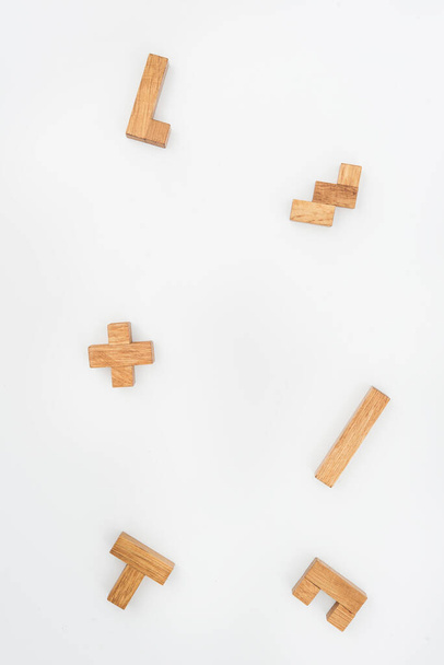 Wooden puzzle pieces as background - Foto, Bild