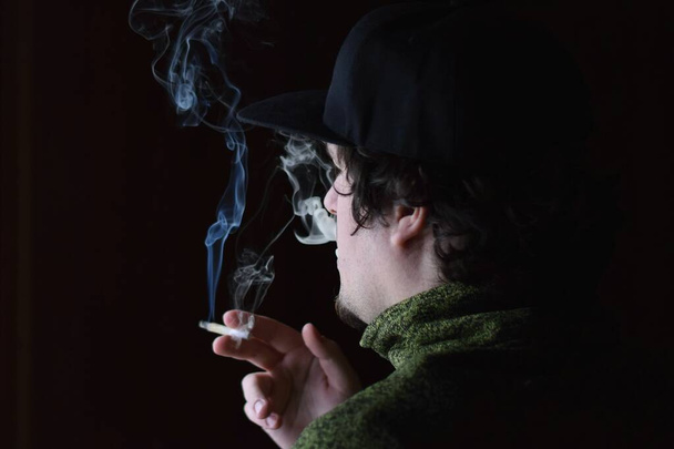 Man smoking cannabis joint - Photo, image