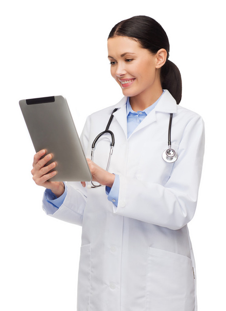 Female doctor with stethoscope and tablet pc - Foto, afbeelding