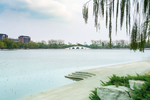 Spring in Yuyuantan Park, Beijing, China.Island in the lake of Yuyuantan Park, Beijing, China - Photo, Image