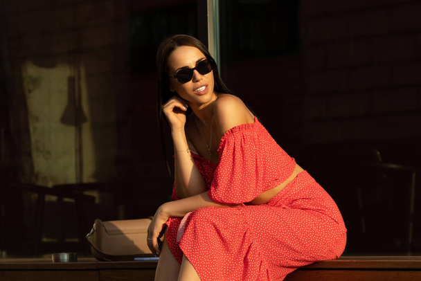 Young smiling brunette woman outdoor. - Fotografie, Obrázek