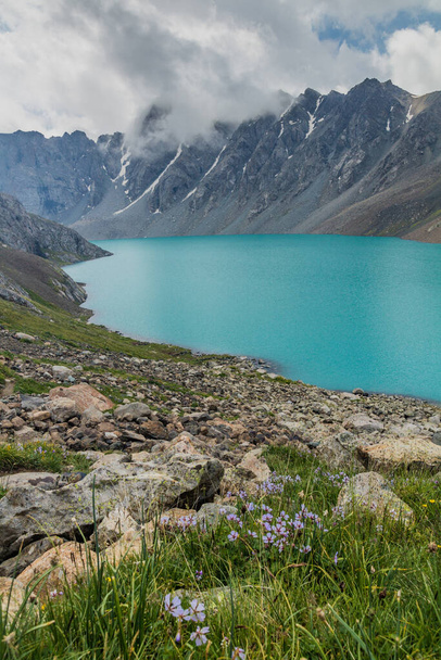 Ala-Kul lake in the Terskey Alatau mountain range in Kyrgyzstan - Фото, зображення