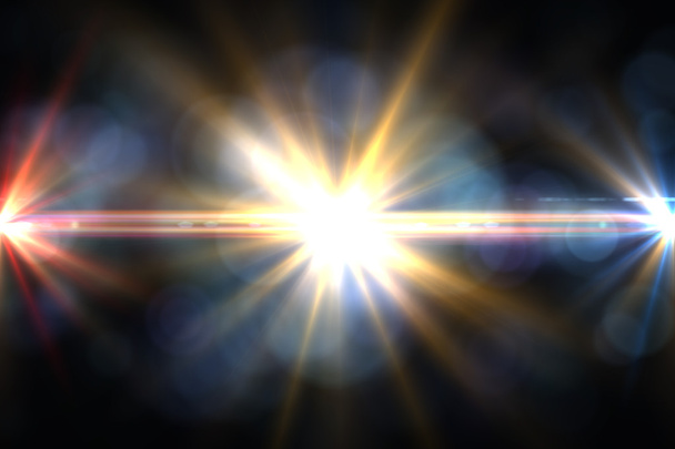 sterren, zon met lens flare. stralen geel van licht op een zwarte achtergrond - Foto, afbeelding