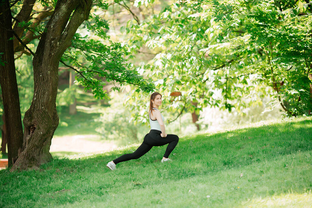 Athlete doing warm-up outdoors. Sports concept. women - Photo, Image