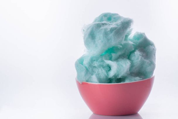 Blue cotton candy in bowl on white background - Foto, Imagem