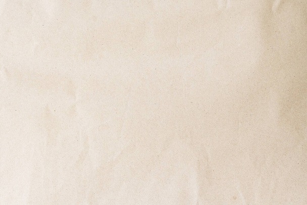 Plain brown eco paper texture in scrap canvas beige backdrop photo concept for letter craft design package box background. Pattern back of smooth parchment rice recycle surface and earth tone - 写真・画像