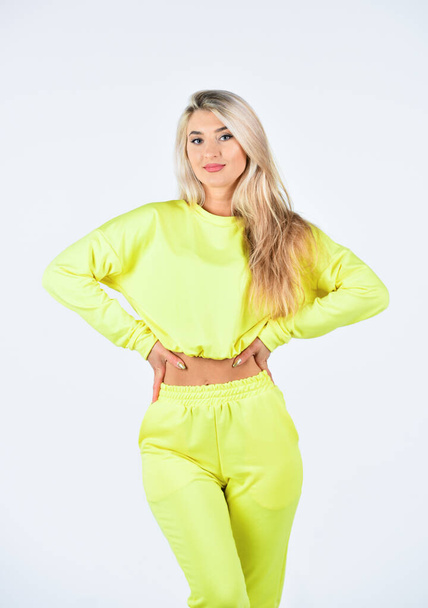 Confident and stylish beauty. girl in training clothes. attractive woman in fashionable sportswear. girl in sweatpants and sweatshirt. outdoor sports and urban style. Beautiful fitness woman - Zdjęcie, obraz