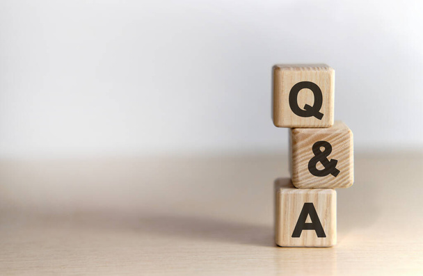 Questions and answer - text on wooden cubes, on White background - Photo, Image