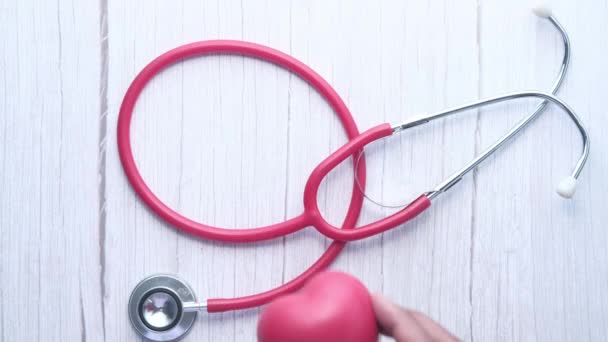heart shape symbol and stethoscope on white background  - Footage, Video