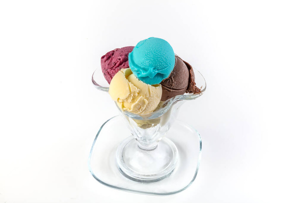 Fruit ice cream. Colorful ice cream balls in bowl with different flavors - mango, lime, mint, pistachio, orange, strawberries, raspberries, blueberries. Summer concept. - Foto, Bild
