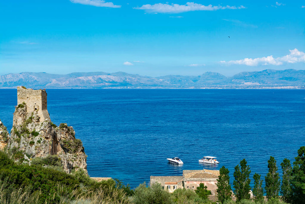 Scenic coastline with rocks and deep blue sea near Castellamare del Golfo by entrance to natural reserve Zingaro, Sicily, Italy - Фото, изображение