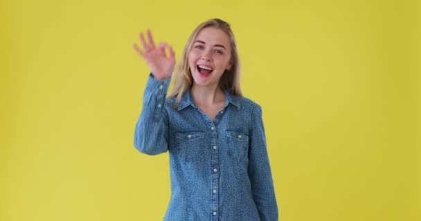 Excited woman celebrating giving ok and thumbs gesture  - Metraje, vídeo