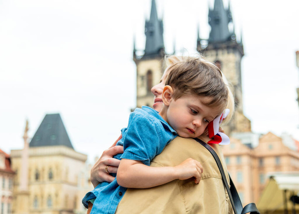 Mother and son at central market square in Prague, Czech Republic - Photo, image