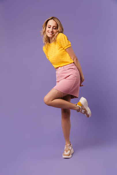 Full length image of nice happy woman posing with eyes closed isolated over purple background - Foto, Imagem