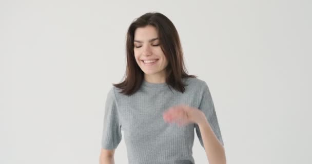 Woman laughing over white background - Felvétel, videó