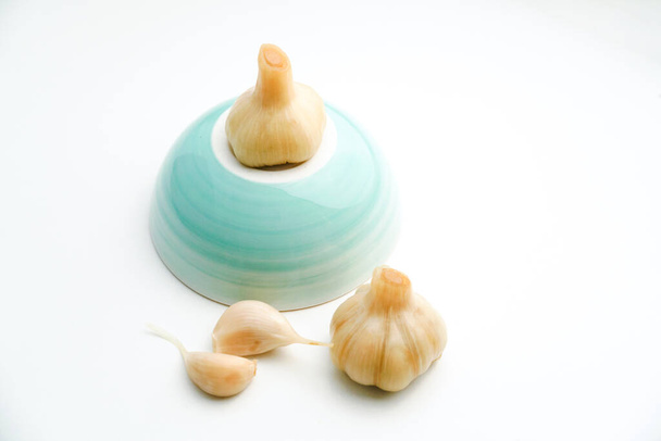 Sugar garlic on the white table. - Photo, image