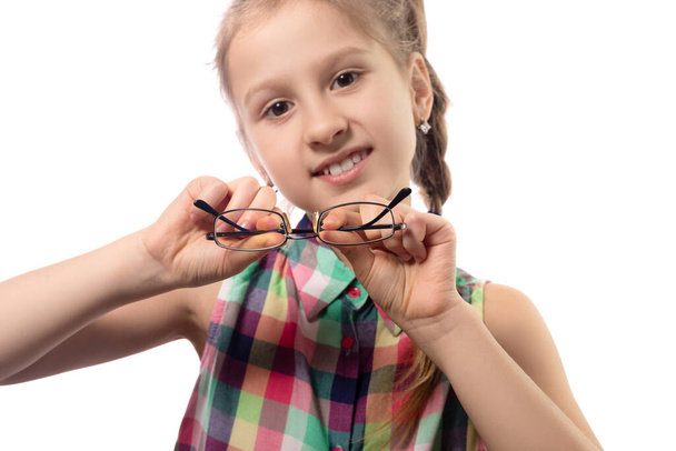 Cute little girl with glasses on white background. Studio shot. - Foto, immagini