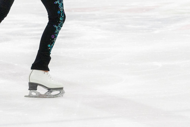 View of figure skater feet at the figure skating practice. - Photo, Image