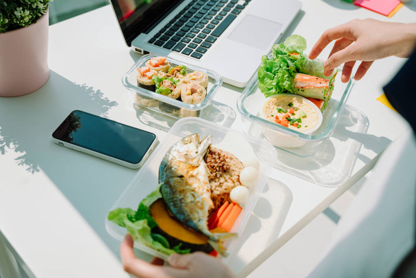 Healthy food lunch break on office desk. Lunch break. Healthy lunch break thaifood. - Photo, Image