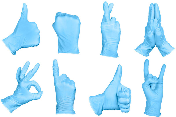Conjunto de gestos de mano o signos en guantes quirúrgicos de látex desechables azules aislados sobre fondo blanco. Juego de letreros
. - Foto, Imagen