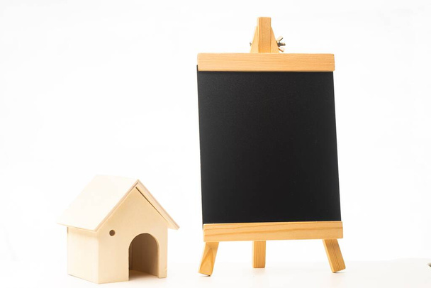 Miniature wooden house isolated against white background - Valokuva, kuva