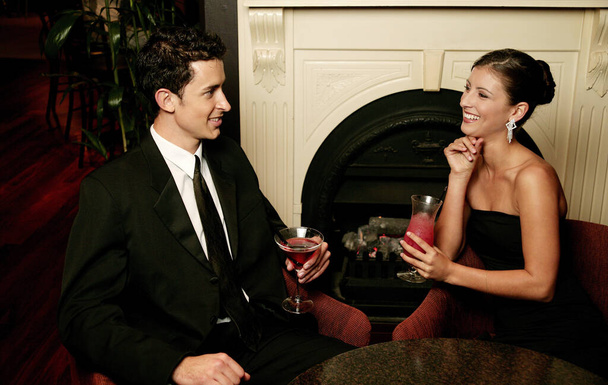 A couple enjoying their drinks - Photo, Image
